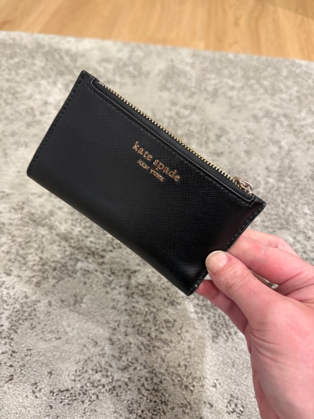kate spade black leather zip pouch with gold logo